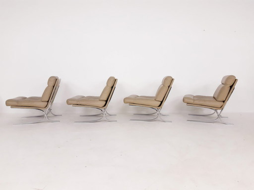 Leather and chrome lounge chairs in the style of Paul Tuttle for Strassle