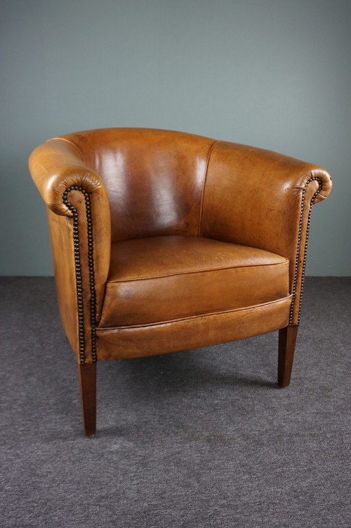 Sturdy sheepskin club chair